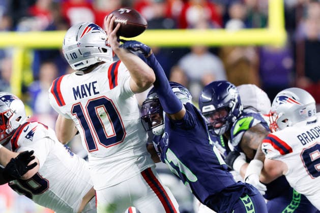 Seattle Seahawks cornerback Devon Witherspoon right, knocks the ball away from New England Patriots quarterback Drake Maye left, during the fourth quarter of Super Bowl LX at Levi s Stadium in Santa Clara, California on Sunday, February 8, 2026.  SBP20260208206 JOHNxANGELILLO