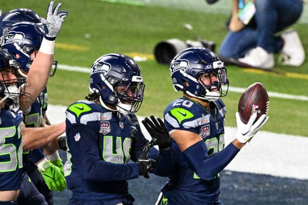 Seattle Seahawks safety Julian Love (20) celebrates after an interception in the fourth quarter against the New England Patriots in Super Bowl LX at Levi s Stadium in Santa Clara, California on Sunday, February 8, 2026.  SBP20260208482 DAVIDxTULIS