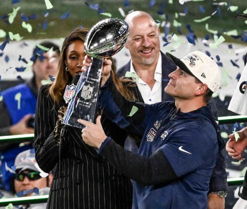 Seattle Seahawks head coach Mike MacDonald holds up the Vince Lombardi trophy after Super Bowl LX at at Levi s Stadium in Santa Clara, California on Sunday, February 8, 2026. The Seattle Seahawks defeated the New England Patriots 29-13.  SBP20260208879 JONxSOOHOO