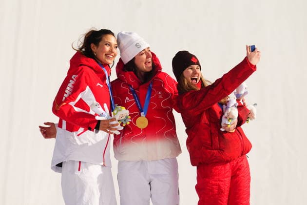 February 9, 2026, Livigno, Italy: Gold medalist Switzerland s Mathilde Gremaud, centre, silver medalist China s Eileen Gu, left, pose as bronze medalist Canada s Megan Oldham takes a photo after the women s freestyle skiing slopestyle finals at the 2026 Winter Olympics, in Livigno, Italy, Monday, Feb. 9, 2026. Canada News - February 9, 2026  - ZUMAc35_ 20260209_zaf_c35_040 Copyright: xSeanxKilpatrickx