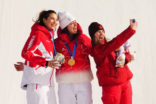 February 9, 2026, Livigno, Italy: Gold medalist Switzerland s Mathilde Gremaud, centre, silver medalist China s Eileen Gu, left, pose as bronze medalist Canada s Megan Oldham takes a photo after the women s freestyle skiing slopestyle finals at the 2026 Winter Olympics, in Livigno, Italy, Monday, Feb. 9, 2026. Canada News - February 9, 2026  - ZUMAc35_ 20260209_zaf_c35_048 Copyright: xSeanxKilpatrickx