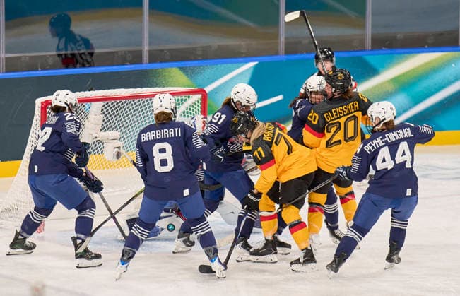 Daria Gleissner of Germany Anne Bartsch of Germany compete and fight for the puck against Jade Barbirati of France Elina Zilliox of France Anais Peyne-Dingival of France at the preliminary women Ice hockey, Eishockey match Group B Germany - France of the Milano Cortina 2026 Winter Olympic Games, Olympische Spiele, Olympia, OS at Milano Rho Ice Hockey Arena on February 9, 2026 in Milan, Italy.