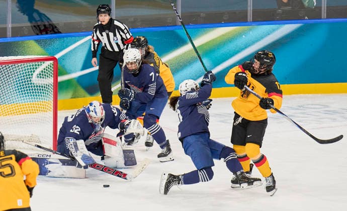 Emily Nix of Germany compete and fight for the puck against Alice Philbert of France at the preliminary women Ice hockey, Eishockey match Group B Germany - France of the Milano Cortina 2026 Winter Olympic Games, Olympische Spiele, Olympia, OS at Milano Rho Ice Hockey Arena on February 9, 2026 in Milan, Italy.