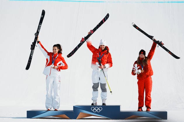 (260209) -- LIVIGNO, Feb. 9, 2026 -- Gold medalist Mathilde Gremaud (C) of Switzerland, silver medalist Gu Ailing (L) of China and bronze medalist Megan Oldham of Canada react during the awarding ceremony for the freestyle skiing women s freeski slopestyle at the Milan-Cortina 2026 Olympic Winter games, Winterspiele,Spiele, Summer games in Livigno, Italy, Feb. 9, 2026. ) (MICO2026)ITALY-LIVIGNO-OLYMPIC WINTER GAMES-FREESTYLE SKIING-WOMEN S FREESKI SLOPESTYLE-AWARDING CEREMONY HuxChao 