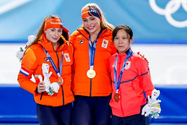 second Femke Kok of the Netherlands and winner Jutta Leerdam of the Netherlands and third Miho Takagi of Japan smiling during the medal ceremony after Women 1000m, Milano Cortina 2026 Winter Olympics: Day 3, Speed skating, Eisschnelllauf - Milano Cortina 2026 Winter Olympics: Day 3, Milano Speed Skating Stadium, February 9, 2026, Milan, Italy.