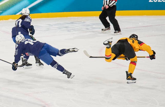 Laura Kluge of Germany compete and fight for the puck against Clara Rozier of France at the preliminary women Ice hockey, Eishockey match Group B Germany - France of the Milano Cortina 2026 Winter Olympic Games, Olympische Spiele, Olympia, OS at Milano Rho Ice Hockey Arena on February 9, 2026 in Milan, Italy.