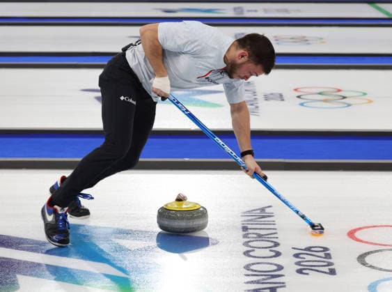 Team USA s Korey Dropkin polishes the ice in the Curling Mixed Doubles Semi-Finals against Italy at the 2026 Winter Olympics in Cortina, Italy on Monday February 09, 2026. Team USA beat Italy 9-8.  OLY2026020696 HUGOxPHILPOTT