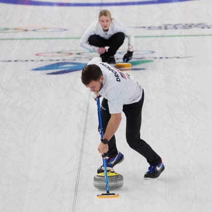 Team USA s Korey Dropkin polishes the ice watched by teammate Corey Thiesse in the Curling Mixed Doubles Semi-Finals against Italy at the 2026 Winter Olympics in Cortina, Italy on Monday February 09, 2026. Team USA beat Italy 9-8.  OLY2026020699 HUGOxPHILPOTT