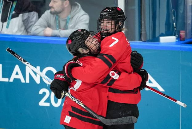 February 9, 2026, Milan, ITALY: Canadas Emma Maltais, left, and Laura Stacey celebrate Stacey s goal against Czechia during the first period of a preliminary round women s hockey game at the Milan Cortina Winter Olympics, in Milan, on Monday, February 9, 2026. Canada News - February 9, 2026  - ZUMAc35_ 20260209_zaf_c35_160 Copyright: xDarrylxDyckx