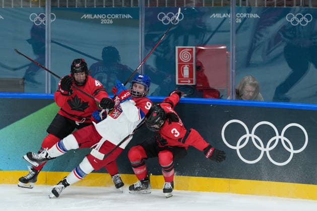 February 9, 2026, Milan, ITALY: CanadaöÄÃ s Blayre Turnbull (40) checks CzechiaöÄÃ s Kristyna Kaltounkova (98) into CanadaöÄÃ s Jocelyne Larocque (3) during the second period of a preliminary round women s hockey game at the Milan Cortina Winter Olympics, in Milan, on Monday, February 9, 2026. Canada News - February 9, 2026  - ZUMAc35_ 20260209_zaf_c35_176 Copyright: xDarrylxDyckx