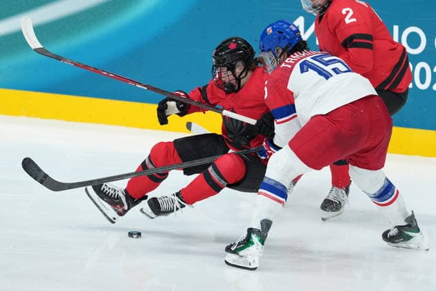 February 9, 2026, Milan, ITALY: CanadaöÄÃ s Sarah Fillier (10) is upended by CzechiaöÄÃ s Andrea Trnkova (15) during the third period of a preliminary round women s hockey game at the Milan Cortina Winter Olympics, in Milan, on Monday, February 9, 2026. Canada News - February 9, 2026  - ZUMAc35_ 20260209_zaf_c35_217 Copyright: xDarrylxDyckx