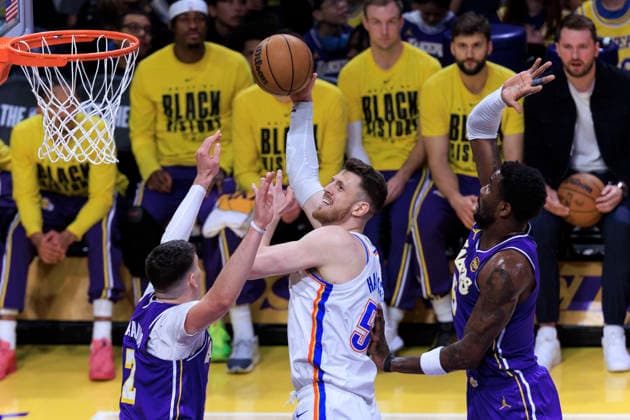 February 9, 2026, Los Angeles, California, USA: Isaiah Hartenstein 55 of the Oklahoma City Thunder makes a two point shot as Jake LaRavia 12 and Deandre Ayton 5 of the Los Angeles Lakers defend during their regular season NBA, Basketball Herren, USA game on Monday February 9, 2026 at Crypto.com Arena in Los Angeles, California. ARIANA RUIZ PI Los Angeles USA - ZUMAp124 20260209_zaa_p124_002 Copyright: xArianaxRuizx