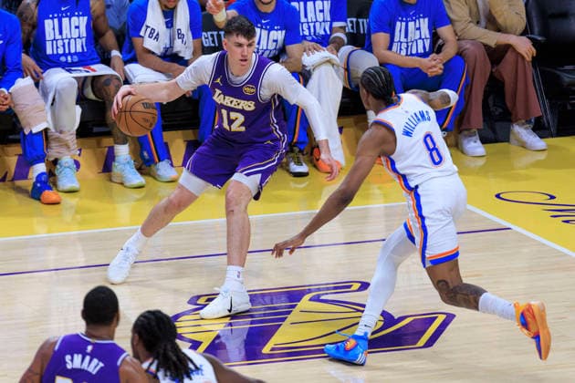 February 9, 2026, Los Angeles, California, USA: Jake LaRavia 12 of the Los Angeles Lakers receives the ball as Jalen Williams 8 of the Oklahoma City Thunder defends during their regular season NBA, Basketball Herren, USA game on Monday February 9, 2026 at Crypto.com Arena in Los Angeles, California. ARIANA RUIZ PI Lakers Vs. Thunder  - ZUMAp124 20260209_zaa_p124_009 Copyright: xArianaxRuizx
