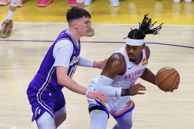 February 9, 2026, Los Angeles, California, USA: Jake LaRavia 12 of the Los Angeles Lakers guards Luguentz Dort 5 of the Oklahoma City Thunder during their regular season NBA, Basketball Herren, USA game on Monday February 9, 2026 at Crypto.com Arena in Los Angeles, California. ARIANA RUIZ PI Lakers Vs. Thunder  - ZUMAp124 20260209_zaa_p124_010 Copyright: xArianaxRuizx