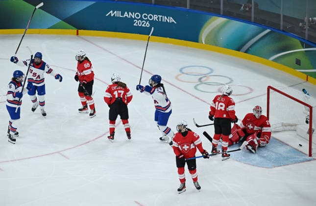 (260210) -- MILAN, Feb. 10, 2026 -- Hayley Scamurra (L) of the United States shoots to score during the Ice hockey, Eishockey women s preliminary round group A match between Switzerland and the United States at the Milan-Cortina 2026 Olympic Winter games, Winterspiele,Spiele, Summer games in Milan, Italy, Feb. 9, 2026. ) (MICO2026)ITALY-MILAN-OLYMPIC WINTER GAMES-ICE HOCKEY-WOMEN-PRELIMINARY-SUI VS USA ZhangxHaofu 