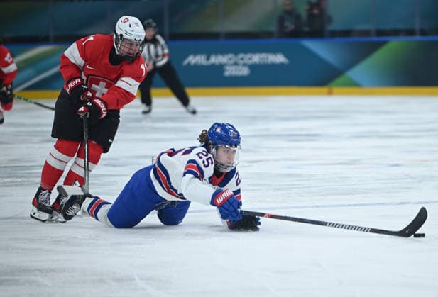 (260210) -- MILAN, Feb. 10, 2026 -- Alex Carpenter (R) of the United States vies with Laura Zimmermann of Switzerland during the Ice hockey, Eishockey women s preliminary round group A match between Switzerland and the United States at the Milan-Cortina 2026 Olympic Winter games, Winterspiele,Spiele, Summer games in Milan, Italy, Feb. 9, 2026. ) (MICO2026)ITALY-MILAN-OLYMPIC WINTER GAMES-ICE HOCKEY-WOMEN-PRELIMINARY-SUI VS USA ZhangxHaofu 