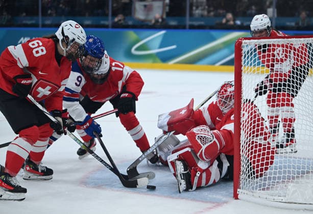 (260210) -- MILAN, Feb. 10, 2026 -- Players of both sides vie for the puck during the Ice hockey, Eishockey women s preliminary round group A match between Switzerland and the United States at the Milan-Cortina 2026 Olympic Winter games, Winterspiele,Spiele, Summer games in Milan, Italy, Feb. 9, 2026. ) (MICO2026)ITALY-MILAN-OLYMPIC WINTER GAMES-ICE HOCKEY-WOMEN-PRELIMINARY-SUI VS USA ZhangxHaofu 