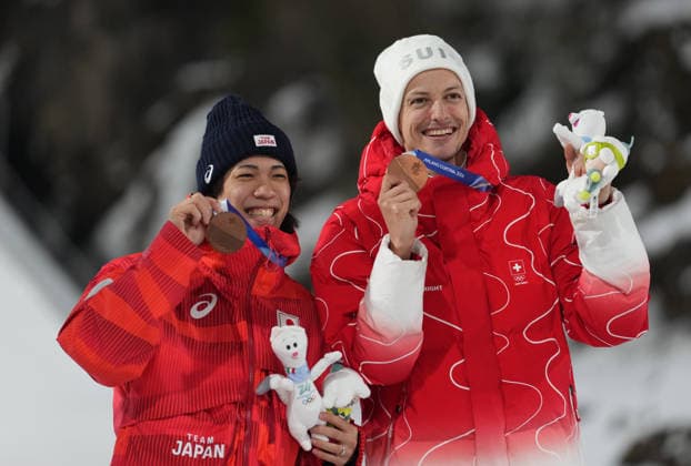 (260210) -- PREDAZZO, Feb. 10, 2026 -- Bronze medalists Nikaido Ren (L) of Japan and Gregor Deschwanden of Switzerland pose for photos with the medals during the awarding ceremony for the Ski jumping, Skispringen, Ski, nordisch Men s Normal Hill Individual of the 2026 Milan-Cortina Winter Olympics in Predazzo, Italy, Feb. 9, 2026. ) (MICO2026)ITALY-PREDAZZO-MILAN-OLYMPIC Winter games, Winterspiele,Spiele, Summer games SKI JUMPING-MEN S NORMAL HILL INDIVIDUAL-AWARDING CEREMONY MengxYongmin 