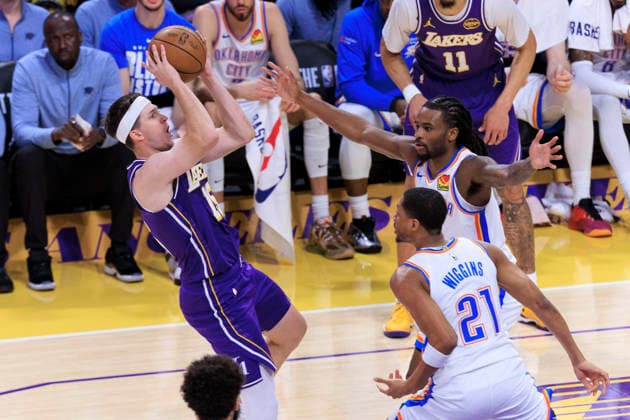 February 9, 2026, Los Angeles, California, USA: Austin Reaves 15 of the Los Angeles Lakers makes a fadeaway shot as Cason Wallace 22 and Aaron Wiggins 21 of the Oklahoma City Thunder defend during their regular season NBA, Basketball Herren, USA game on Monday February 9, 2026 at Crypto.com Arena in Los Angeles, California. Lakers lose to Thunder, 110-119. ARIANA RUIZ PI Los Angeles USA - ZUMAp124 20260209_zaa_p124_021 Copyright: xArianaxRuizx