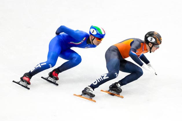 2026-02-10 - Milano Cortina 2026 Winter Olympics MILAN, ITALY - FEBRUARY 10: Jens van t Wout of Netherlands, Pietro Sighel of Italy performing on the Mixed Team Relay - Quarterfinals during the Milano Cortina 2026 Winter Olympics at the Milano Ice Skating Arena on February 10, 2026 in Milan, Italy Milan Milano Ice Skating Arena Italy Content not available for redistribution in The Netherlands directly or indirectly through any third parties. Copyright: xAndrexWeeningx