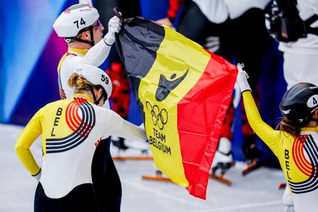 third team of Belgium and Ward Petre of Belgium and Hanne Desmet of Belgium and Tineke den Dulk of Belgium celebrating and holding flag after Mixed Team Relay Finals, Milano Cortina 2026 Winter Olympics: Day 4, Short Track Speed skating, Eisschnelllauf - Milano Cortina 2026 Winter Olympics: Day 4, Milano Speed Skating Stadium, February 10, 2026, Milan, Italy.
