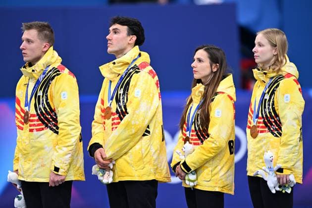 Belgian shorttrack skater Ward Petre, Belgian shorttrack skater Stijn Desmet, Belgian shorttrack skater Hanne Desmet and Belgian shorttrack skater Tineke den Dulk celebrate their bronze medal on the podium the Mixed Team Relay of the Short Track Speed skating, Eisschnelllauf competition at the Milano Cortina 2026 Olympic Winter games, Winterspiele,Spiele, Summer games on Tuesday 10 February 2026 in Milan, Italy. The XXV Winter Olympics take place from 6 to 22 February 2026 in Italy. JASPERxJACOBS  x162380140x