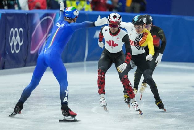 February 10, 2026, Milan, ITALY: CanadaöÄÃ s William Dandjinou, centre, crosses in second place for the silver medal in the team mixed relay short track Speed skating, Eisschnelllauf at the 2026 Winter Olympics, in Milan, Italy, Tuesday, Feb. 10, 2026. Canada News - February 10, 2026  - ZUMAc35_ 20260210_zaf_c35_056 Copyright: xDarrylxDyckx