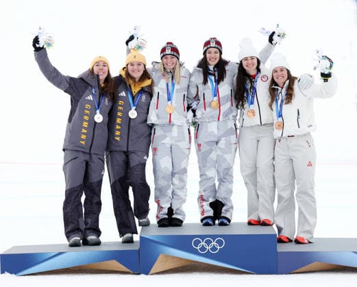 L-R Team Germany Kira Weidle-Winkelmann, Emma Aicher Austria s Ariane Radler,Katharina Huber,USA s Jacqueline Wiles and Paula Moltzan celebrate their medals after the Women s Team combined downhill race at the 2026 Winter Olympics in Cortina, Italy on Tuesday February 10, 2026. Austria won gold, Germany won the silver and USA won bronze..  OLY20260210646 HUGOxPHILPOTT