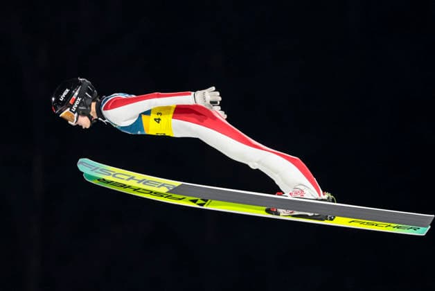 OLYMPICS - Winter Olympic Games, Olympische Spiele, Olympia, OS Milano Cortina 2026 PREDAZZO,ITALY,10.FEB.26 - OLYMPICS, Ski jumping, Skispringen, Ski, nordisch - Winter Olympic Games Milano Cortina 2026, normal hill, mixed team. Image shows Qi Liu (CHN).  GEPAxpictures xMatthiasxTrinkl