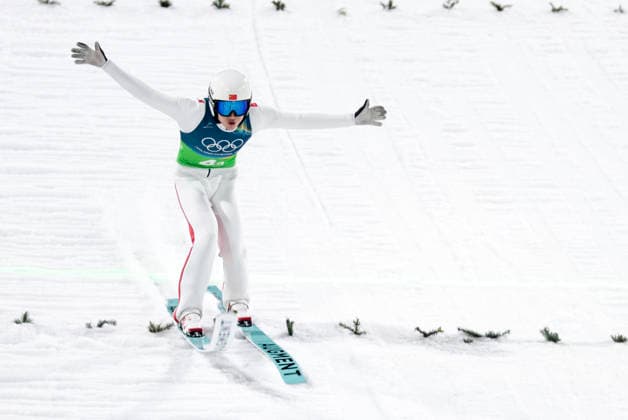 OLYMPICS - Winter Olympic Games, Olympische Spiele, Olympia, OS Milano Cortina 2026 PREDAZZO,ITALY,10.FEB.26 - OLYMPICS, Ski jumping, Skispringen, Ski, nordisch - Winter Olympic Games Milano Cortina 2026, normal hill, mixed team. Image shows Qiwu Song (CHN).  GEPAxpictures xMatthiasxTrinkl