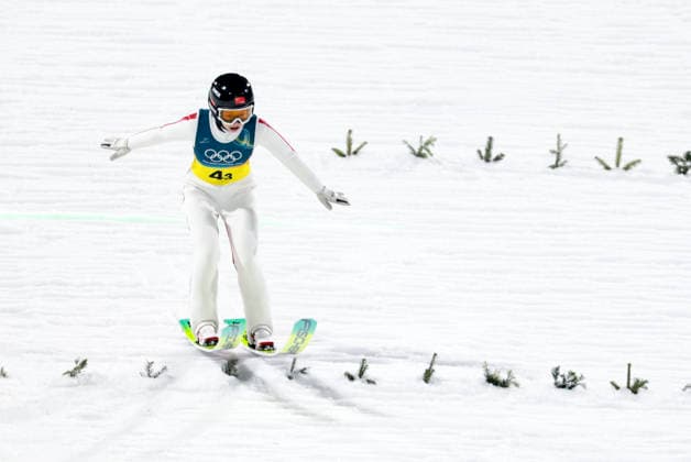 OLYMPICS - Winter Olympic Games, Olympische Spiele, Olympia, OS Milano Cortina 2026 PREDAZZO,ITALY,10.FEB.26 - OLYMPICS, Ski jumping, Skispringen, Ski, nordisch - Winter Olympic Games Milano Cortina 2026, normal hill, mixed team. Image shows Qi Liu (CHN).  GEPAxpictures xMatthiasxTrinkl