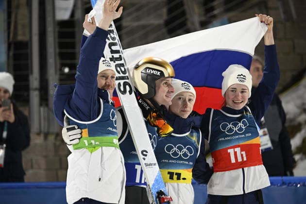LKS 20260210 Anze Lanisek (L), Domen Prevc, Nika Vodan and Nika Prevc of Slovenia react in the finish area after winning the Ski jumping, Skispringen, Ski, nordisch Mixed Team event at the Milano Cortina Winter Olympics at the Predazzo Ski Jumping Stadium on February 10, 2026. - MARKKU ULANDER Predazzo Italy BJr1oQY42qc  Copyright: xMarkkuxUlanderx BJr1oQY42qc