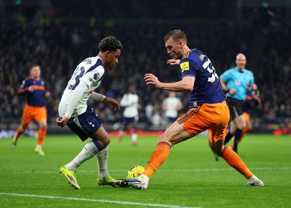 10th February 2026; Tottenham Hotspur Stadium, London, England; Premier League Football, Tottenham Hotspur versus Newcastle United; Wilson Odobert of Tottenham Hotspur under pressure from Dan Burn of Newcastle United  JohnxPatrickxFletcher Content restricted for UK based newspaper