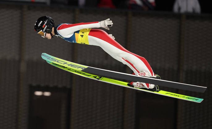 (260210) -- PREDAZZO, Feb. 10, 2026 -- Liu Qi of China competes during the Ski jumping, Skispringen, Ski, nordisch mixed team match at the Milan-Cortina 2026 Olympic Winter games, Winterspiele,Spiele, Summer games in Predazzo, Italy, Feb. 10, 2026. ) (MICO2026)ITALY-PREDAZZO-OLYMPIC WINTER GAMES-SKI JUMPING-MIXED TEAM HuangxWei 