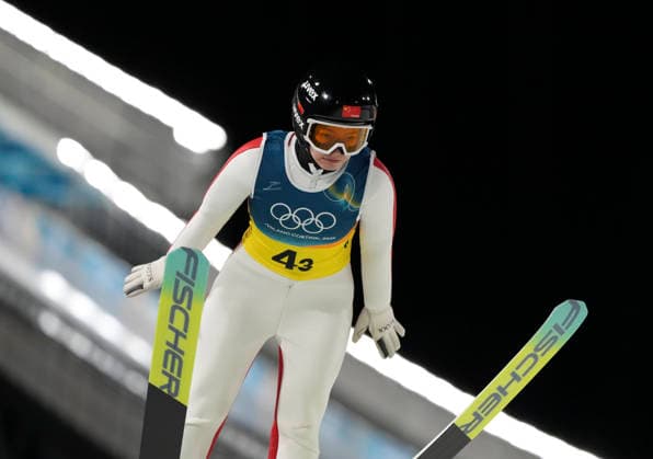 (260210) -- PREDAZZO, Feb. 10, 2026 -- Liu Qi of China competes during the Ski jumping, Skispringen, Ski, nordisch mixed team match at the Milan-Cortina 2026 Olympic Winter games, Winterspiele,Spiele, Summer games in Predazzo, Italy, Feb. 10, 2026. ) (MICO2026)ITALY-PREDAZZO-OLYMPIC WINTER GAMES-SKI JUMPING-MIXED TEAM MengxYongmin 