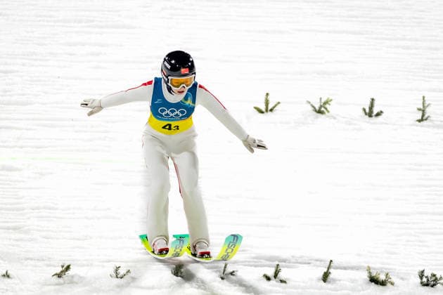 OLYMPICS - Winter Olympic Games, Olympische Spiele, Olympia, OS Milano Cortina 2026 PREDAZZO,ITALY,10.FEB.26 - OLYMPICS, Ski jumping, Skispringen, Ski, nordisch - Winter Olympic Games Milano Cortina 2026, normal hill, mixed team. Image shows Qi Liu (CHN).  GEPAxpictures xMatthiasxTrinkl