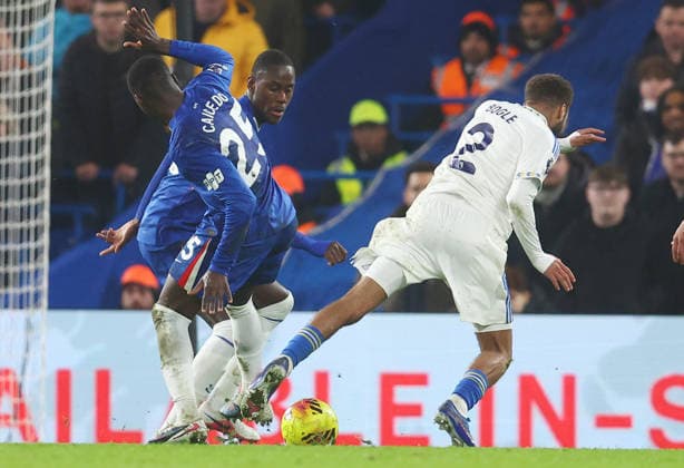 London, England, 10th February 2026. Jayden Bogle of Leeds United wins a penalty as he is fouled by Moises Caicedo of Chelsea during the Chelsea vs Leeds United Premier League match at Stamford Bridge, London. Picture credit should read: Paul Terry Sportimage EDITORIAL USE ONLY. No use with unauthorised audio, video, data, fixture lists, club league logos or live services. Online in-match use limited to 120 images, no video emulation. No use in betting, games or single club league player publications. SPI_040_PT_Chelsea_v_Leeds_United SPI-4517-0040