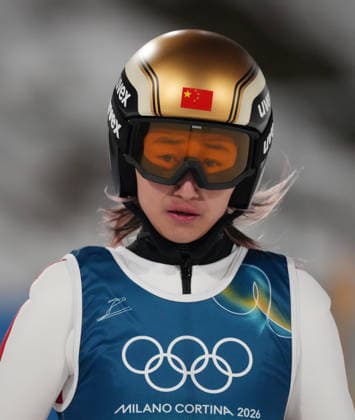 (260210) -- PREDAZZO, Feb. 10, 2026 -- Zeng Ping of China reacts during the Ski jumping, Skispringen, Ski, nordisch mixed team final round match at the Milan-Cortina 2026 Olympic Winter games, Winterspiele,Spiele, Summer games in Predazzo, Italy, Feb. 10, 2026. ) (MICO2026)ITALY-PREDAZZO-OLYMPIC WINTER GAMES-SKI JUMPING-MIXED TEAM HuangxWei 