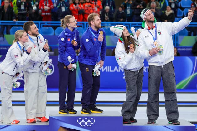 CORTINA D AMPEZZO, ITALY - FEBRUARY 10: Gold medalists Isabella Wranaa and Rasmus Wranaa of Team Sweden, silver medalists Korey Dropkin and Cory Thiesse of Team United States, and bronze medalists Amos Mosaner and Stefania Constantini of Team Italy celebrate on the podium after the Curling Mixed Doubles Gold Medal Game on day four of the Milano Cortina 2026 Winter Olympics at Cortina Curling Olympic Stadium on February 10, 2026 in Cortina d Ampezzo, Italy.  Copyright: xChinaxNewsxServicex 111620488192