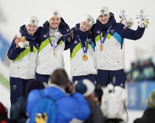 Milan Cortina Olympics: Ski jumping, Skispringen, Ski, nordisch Slovenian ski jumpers (from L) Nika Vodan, Anze Lanisek, Nika Prevc and Domen Prevc pose after winning the mixed team gold at the Milan Cortina Olympics on Feb. 10, 2026, at Predazzo Ski Jumping Stadium in Predazzo, Italy.  A14AA0005268272P