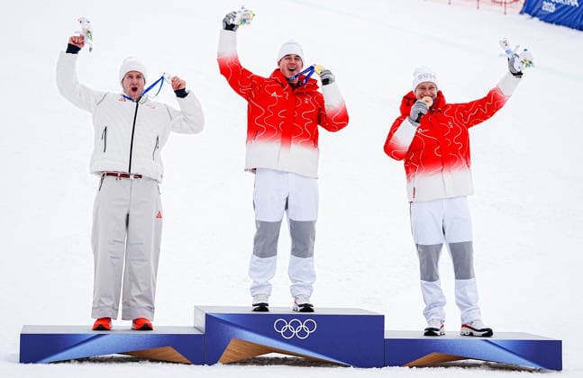(260211) -- BORMIO, Feb. 11, 2026 -- Gold medalist Franjo von Allmen (C) of Switzerland, silver medalist Ryan Cochran-Siegle (L) of the United States and bronze medalist Marco Odermatt of Switzerland react during the awarding ceremony for the alpine skiing men s Super-G at the Milan-Cortina 2026 Olympic Winter games, Winterspiele,Spiele, Summer games in Bormio, Italy, Feb. 11, 2026. ) (MICO2026)ITALY-BORMIO-OLYMPIC WINTER GAMES-ALPINE SKIING-MEN S SUPER-G YanxLinyun 