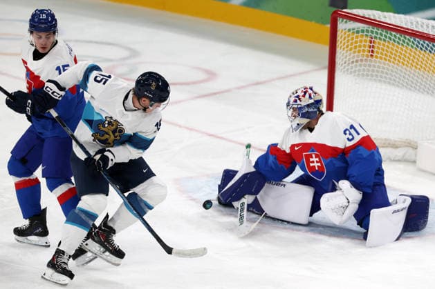 Milano Cortina 2026, Milan, Italy, 11.02, 2026, MiCo2026, MiCo, 2026, Olympics, Olympic, Winter Olympic, Olympic Winter games, Winterspiele,Spiele, Summer games Ice hockey, Eishockey Finland, Slovakia Samuel Hlavaj of Slovakia and Anton Lundell of Finland in action during Men™s Premilinary round Group B Ice Hockey match between Slovakia and Finland teams of Milano Cortina 2026 Olympic Winter Games in Milan, Italy, 11.02.2026. Photo: Roman Koksarov (RKF) Milan Italy Copyright: xRomanxKoksarovx 0B4A0210.JPG