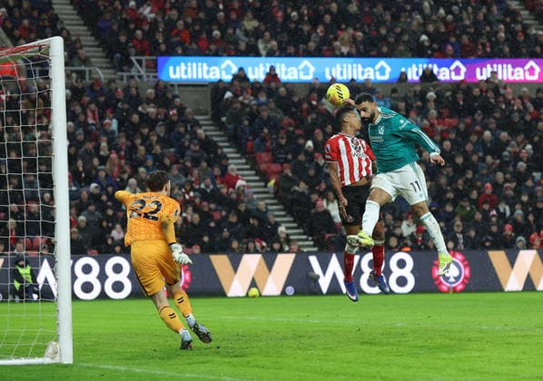 Sunderland, England, 11th February 2026. Mo Salah (R) of Liverpool heads wide during the Sunderland vs Liverpool Premier League match at the Stadium Of Light, Sunderland. Picture credit should read: Nigel Roddis Sportimage EDITORIAL USE ONLY. No use with unauthorised audio, video, data, fixture lists, club league logos or live services. Online in-match use limited to 120 images, no video emulation. No use in betting, games or single club league player publications. SPI_016_NR_SUND_LIVE SPI-4522-0014