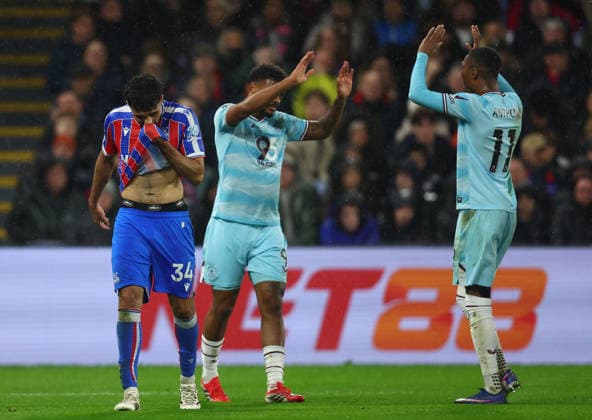 London, England, 11th February 2026. Chadi Riad of Crystal Palace looks dejected as Lyle Foster (L) and Jaidon Anthony of Burnley celebrate during the Crystal Palace vs Burnley Premier League match at Selhurst Park, London. Picture credit should read: Paul Terry Sportimage EDITORIAL USE ONLY. No use with unauthorised audio, video, data, fixture lists, club league logos or live services. Online in-match use limited to 120 images, no video emulation. No use in betting, games or single club league player publications. SPI_038_PT_Crystal_Palace_Burnley SPI-4518-0039