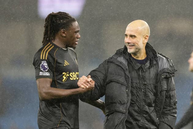 11th February 2026; Etihad Stadium, Manchester, Lancashire, England; Premier League Football, Manchester City versus Fulham; Manchester City manager Pep Guardiola talks with Calvin Bassey of Fulham after the game  RogerxEvans Content restricted for UK based newspaper
