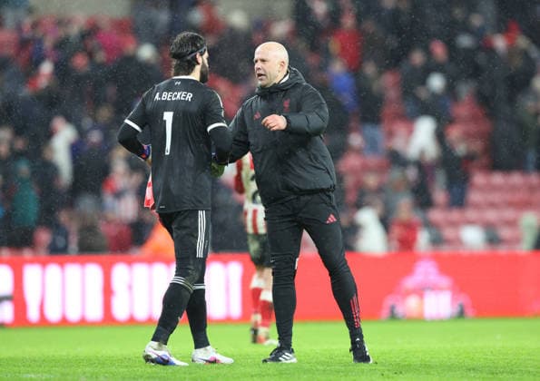 Sunderland, England, 11th February 2026. Alisson Becker (L) with Arne Slot manager of Liverpool after the Sunderland vs Liverpool Premier League match at the Stadium Of Light, Sunderland. Picture credit should read: Nigel Roddis Sportimage EDITORIAL USE ONLY. No use with unauthorised audio, video, data, fixture lists, club league logos or live services. Online in-match use limited to 120 images, no video emulation. No use in betting, games or single club league player publications. SPI_023_NR_SUND_LIVE SPI-4522-0023