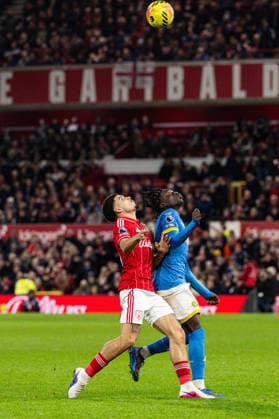 11th February 2026; The City Ground, Nottingham, England; Premier League Football, Nottingham Forest versus Wolverhampton Wanderers; Morgan Gibbs-White of Nottingham Forest and Mateus Mane of Wolverhampton Wanderers compete for a high ball  GodfreyxPitt Content restricted for UK based newspaper