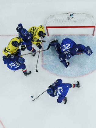 (260212) -- MILAN, Feb. 12, 2026 -- Players of both teams compete during the Ice hockey, Eishockey men s preliminary round group B match between Italy and Sweden at the Milan-Cortina 2026 Olympic Winter games, Winterspiele,Spiele, Summer games in Milan, Italy, Feb. 11, 2026. ) (MICO2026)ITALY-MILAN-OLYMPIC WINTER GAMES-ICE HOCKEY-MEN-PRELIMINARY-ITA VS SWE ZhangxHaofu 