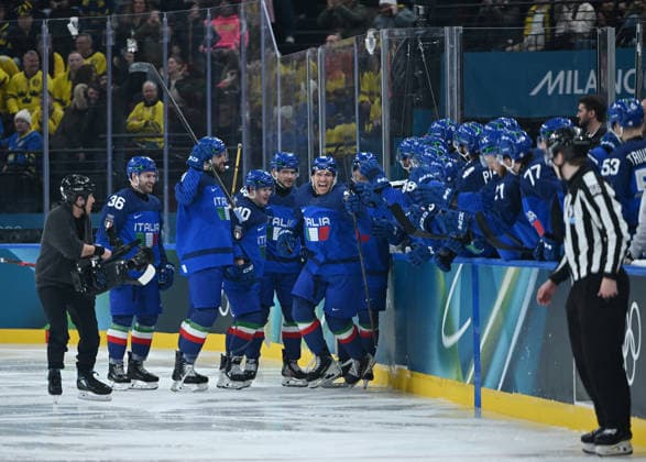 (260212) -- MILAN, Feb. 12, 2026 -- Players of Italy celebrate a goal during the Ice hockey, Eishockey men s preliminary round group B match between Italy and Sweden at the Milan-Cortina 2026 Olympic Winter games, Winterspiele,Spiele, Summer games in Milan, Italy, Feb. 11, 2026. ) (MICO2026)ITALY-MILAN-OLYMPIC WINTER GAMES-ICE HOCKEY-MEN-PRELIMINARY-ITA VS SWE ZhangxHaofu 