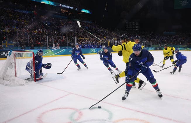 (260212) -- MILAN, Feb. 12, 2026 -- Gregory di Tomaso (front R) of Italy breaks through during the Ice hockey, Eishockey men s preliminary round group B match between Italy and Sweden at the Milan-Cortina 2026 Olympic Winter games, Winterspiele,Spiele, Summer games in Milan, Italy, Feb. 11, 2026. ) (MICO2026)ITALY-MILAN-OLYMPIC WINTER GAMES-ICE HOCKEY-MEN-PRELIMINARY-ITA VS SWE WangxKaiyan 